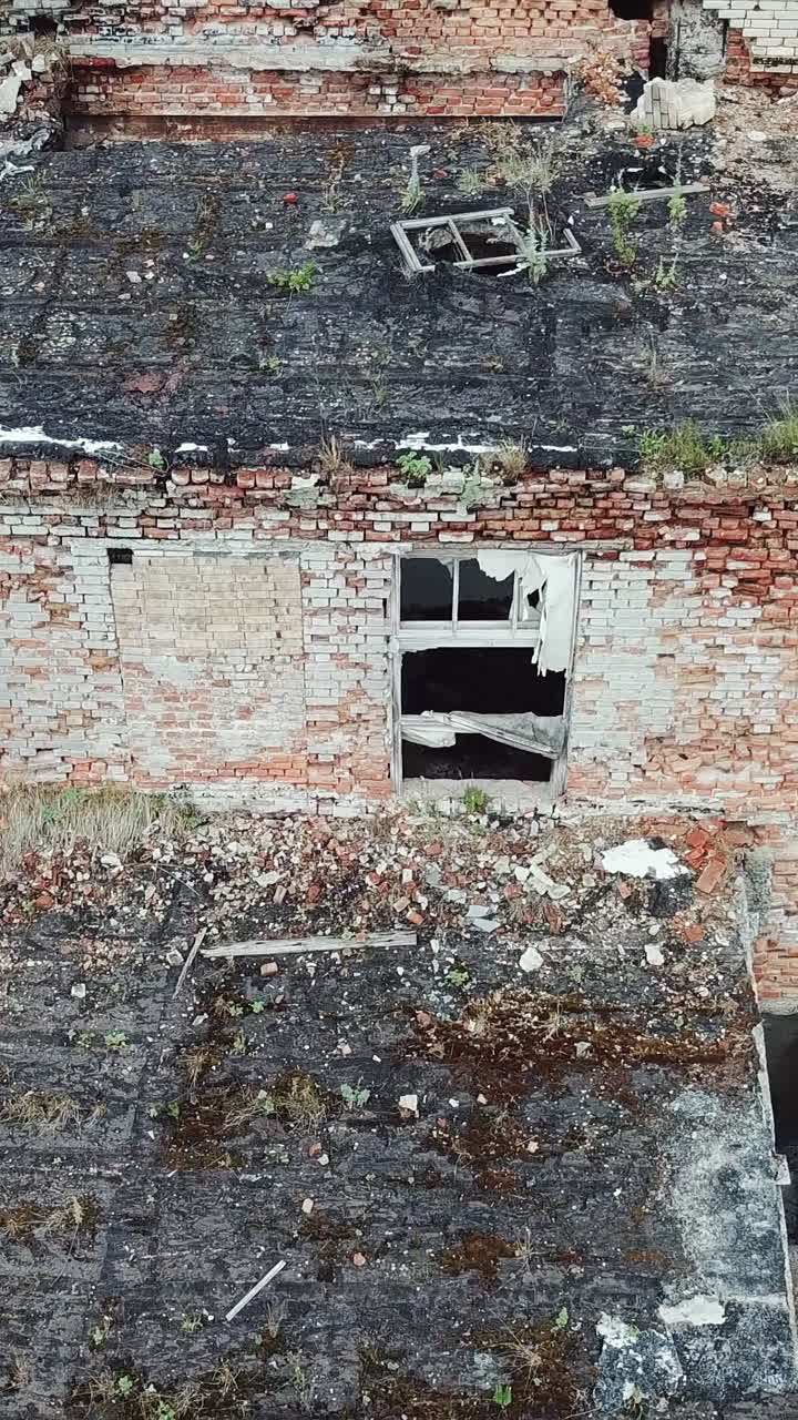 Abandoned chemical plant. Old industrial building for demolition. Aerial view. Vertical video