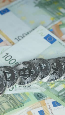 cryptocurrency coins lying on the euro banknotes