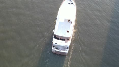 top view of the white luxury yacht sailing at lake pontchartrain in louisiana, usa. aerial