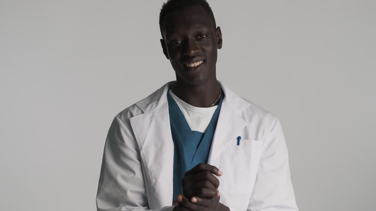 African american doctor on grey background.