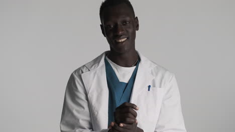 african american doctor on grey background.