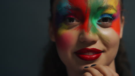 close up portrait beautiful woman wearing colorful face paint exotic multicolored body art sensual female enjoying creative expression