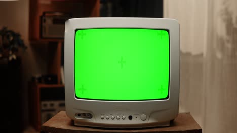 vintage television with green screen