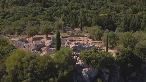 Drone-shooting-parallax-of-ancient-ruins-of-Odysseus'-palace-in-Ithaka,-archeological-exavation-site