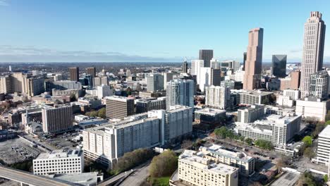 drone shot revealing downtown atlanta state highway during the daytime, expressway traffic movement, georgia, usa