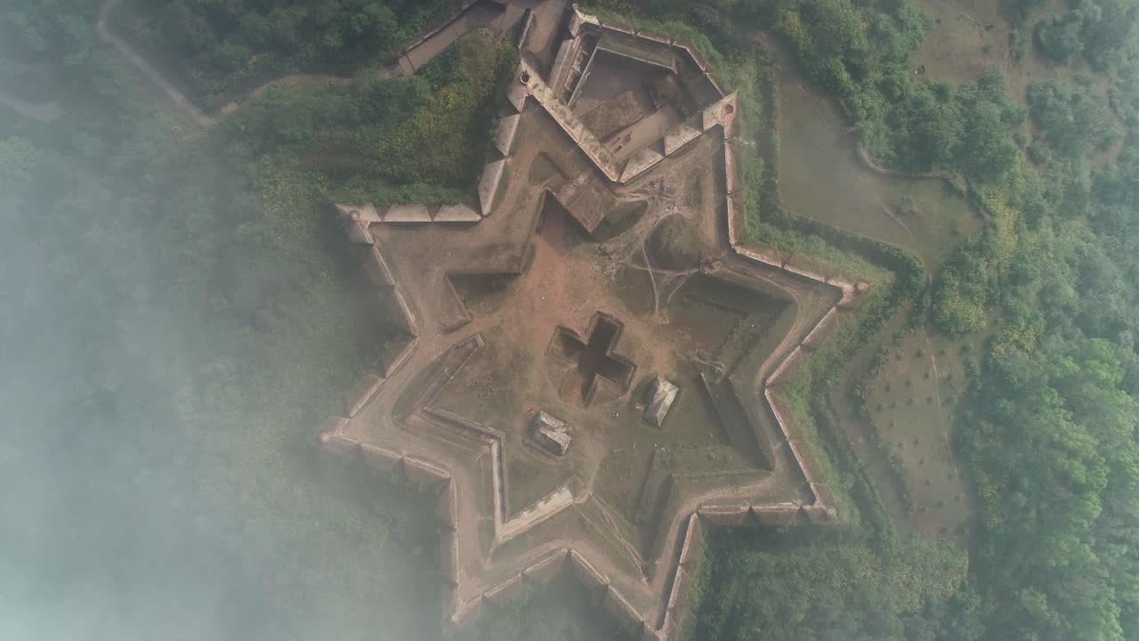 Aerial birds eye descending towards star shaped Manjarabad fort, India