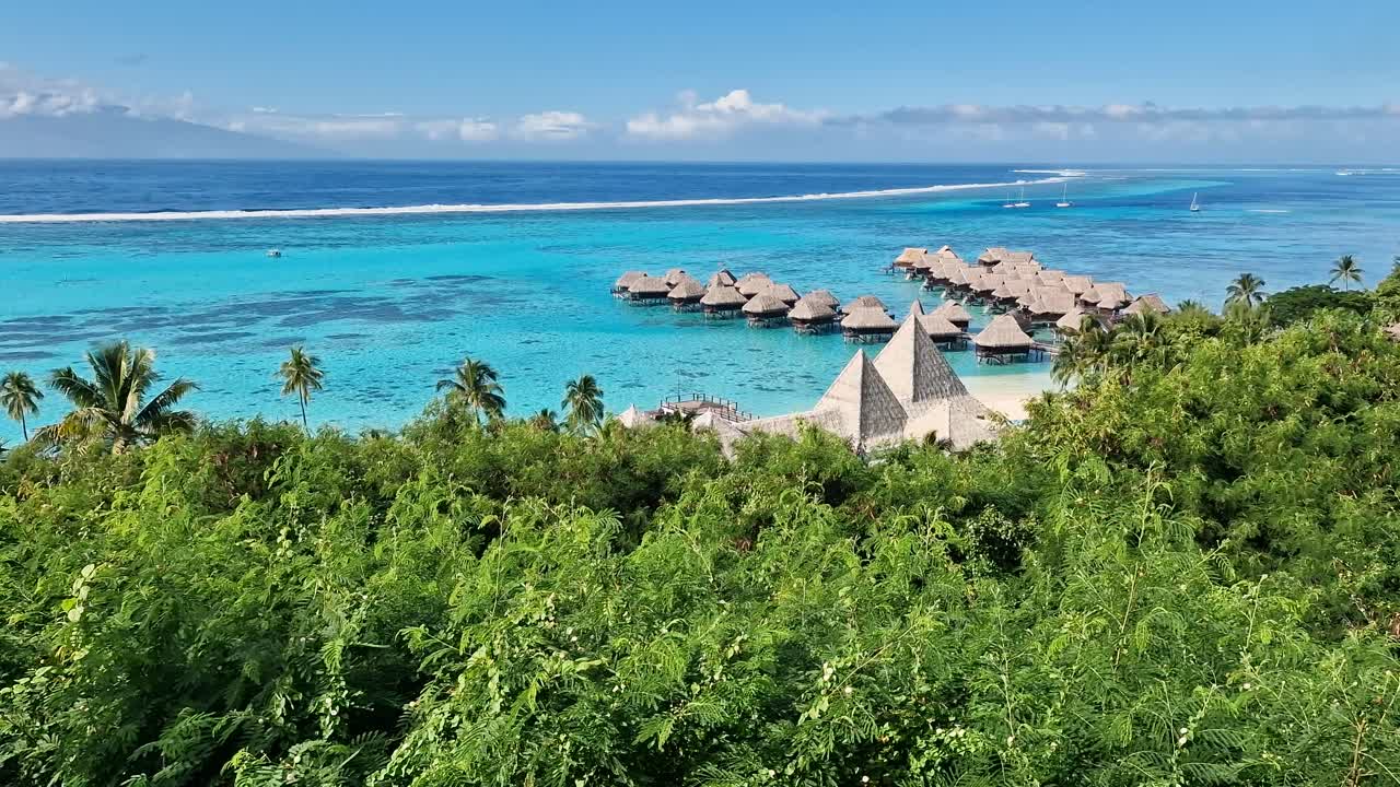 Moore Island, French Polynesia. Overwater Bungalows of Luxury Tropical Resort and Turquoise Lagoon