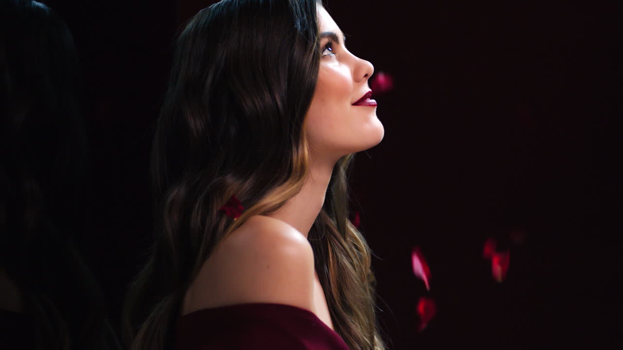 Valentines day, rose and petals falling on woman