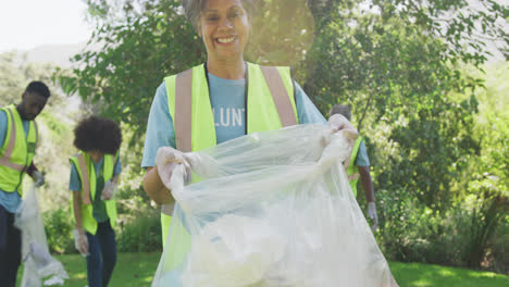 Happy-family-cleaning-a-garden-together