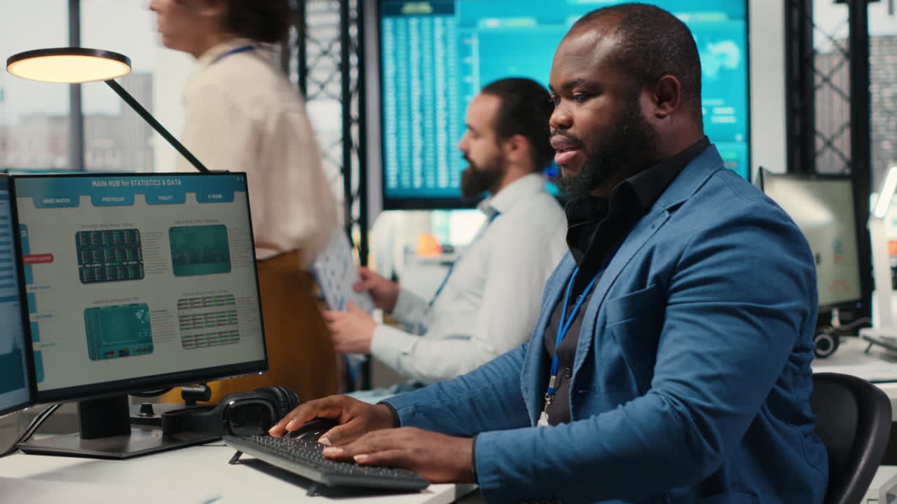 Vertical Video Black employee using data and technology for business management