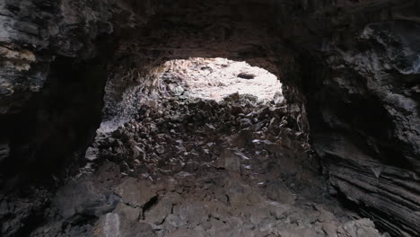 4K-aerial-moving-through-inside-of-massive-lave-tube-rock-cave