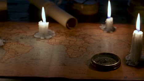 vintage world map with candles and compass
