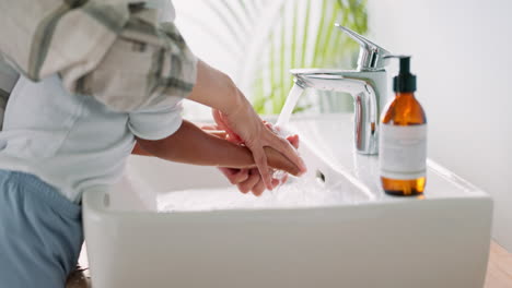 mother, wash and hands of child with tap