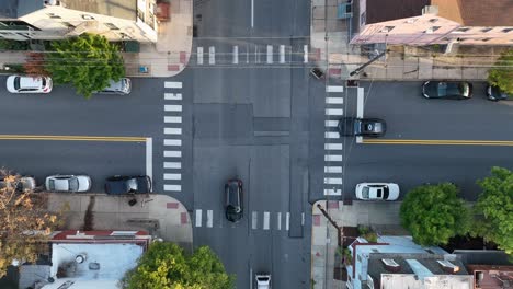 top down aerial of traffic and cars at intersection