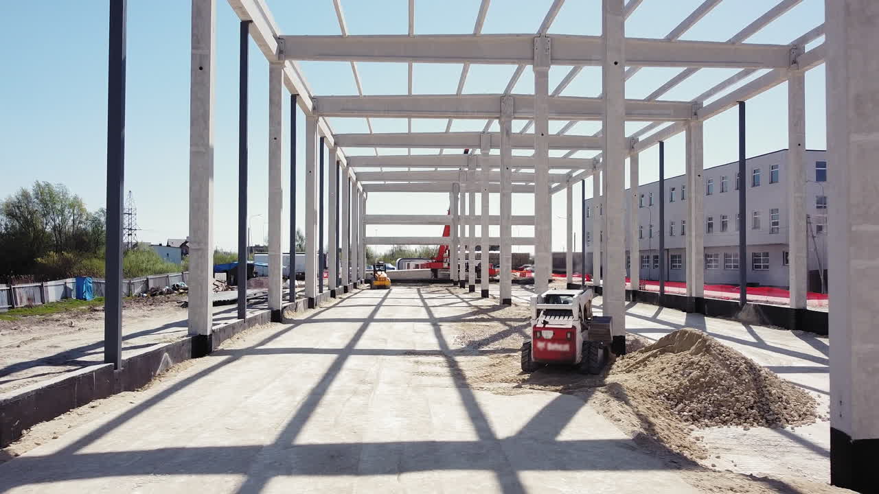 Construction Site with Loader and Concrete Frame