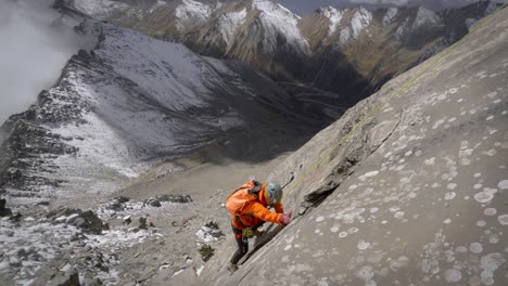 trad climber ascending on route