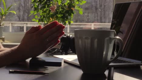 closeup of man praying at home in front of computer work study desk, day