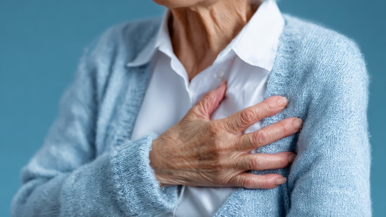 A Close-Up of an Elderly Woman Grasping Her Chest, Expressing Concern, and Possible Discomfort, Highlighting the Importance of Health Awareness and Monitoring in Older Adults