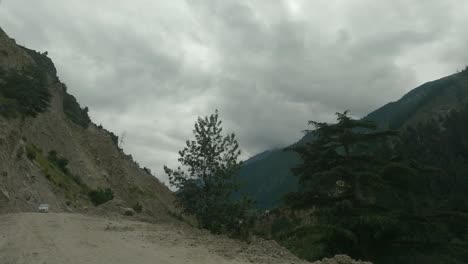 a timelapse of a vehicle passing through the most dangerous and narrow cliff-carved roads through indian himalayas in kinnaur district on way to sangla and chitkul valley-2