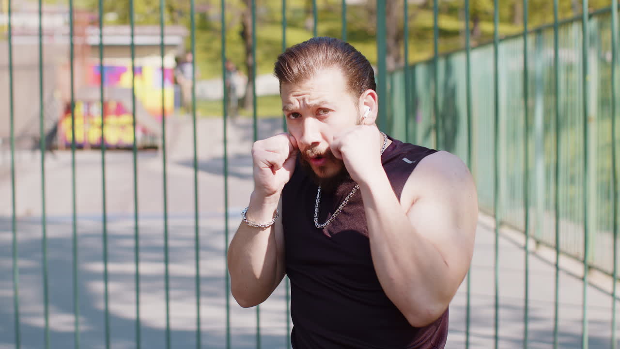 Athletic lebanese man in sportswear doing sport training shadow boxing fitness aerobics cardio