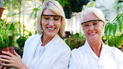 Female-scientists-smiling-in-greenhouse