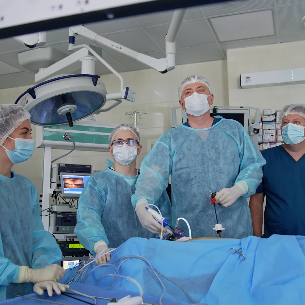 Minimally invasive surgical treatment. Operation with laparoscopic equipment in surgery room