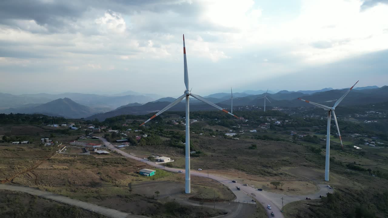 Aerial view of wind turbines at sunset, Honduras, Renewable energy scene.