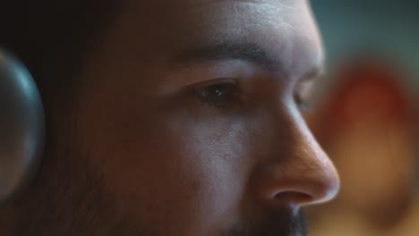 Extreme-closeup-on-caucasian-male-face-shows-eye-movement-during-screen-time