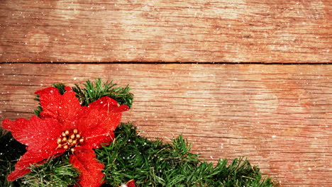 nieve cayendo con decoración de madera de navidad