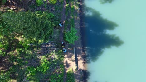 paddleboarders hike to mountain lake in utah with inflatable sup aerial footage