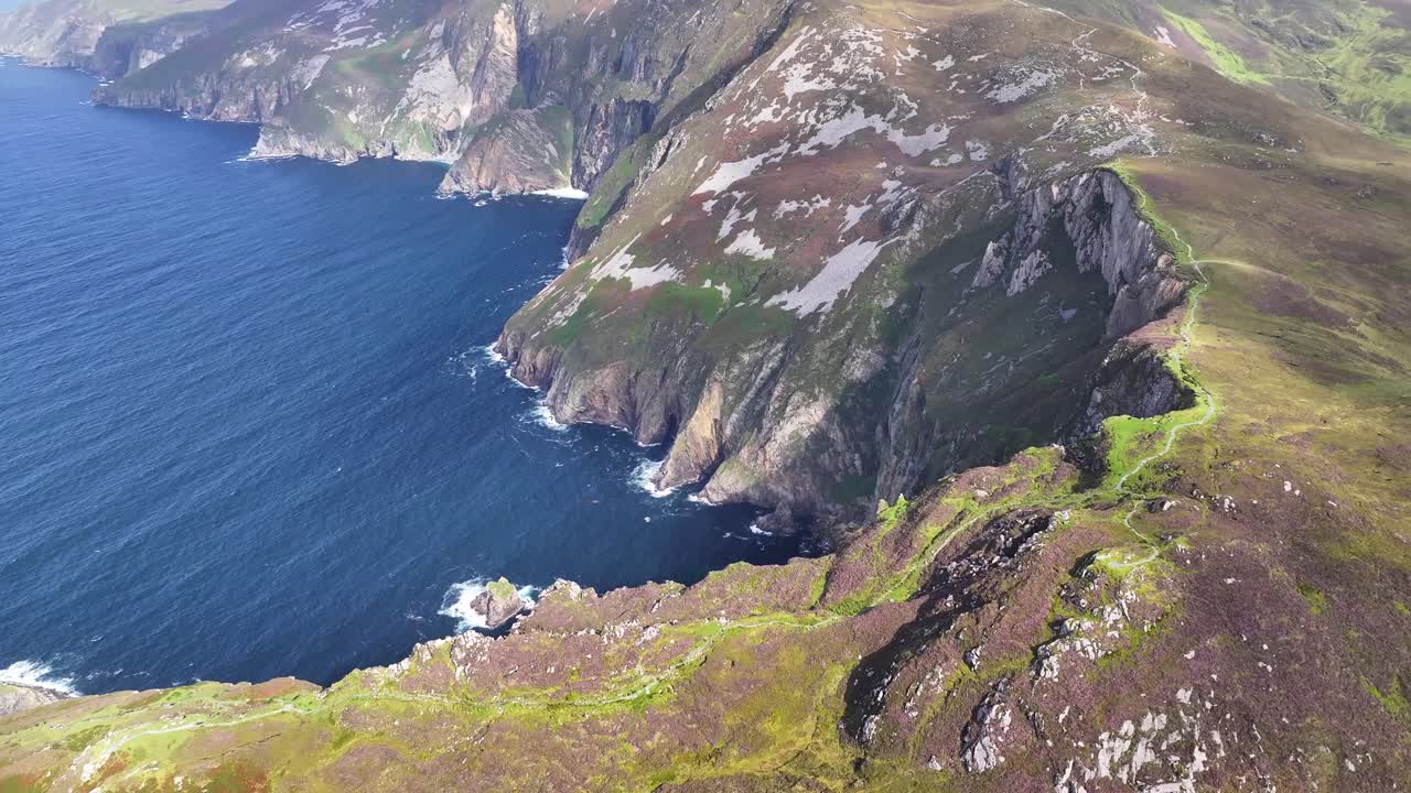 Slieve League mountain peak over the cliffs. Beautiful scenery of Donegal, Ireland. Drone reveal