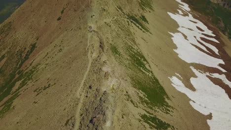 Panning-Up-Drone-Shot-Revealing-the-beautiful-rocky-mountain-tops-of-the-Wasatch-Mountains-in-Utah