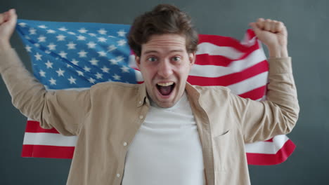 man celebrating with american flag