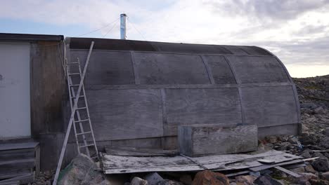 Abandoned-Shelter-and-Houses-on-Coast-of-Greenland,-Panorama