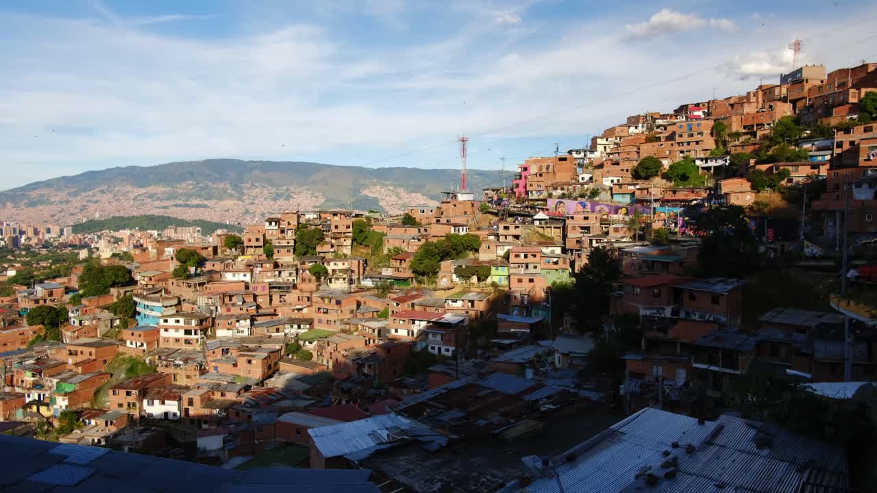 Mountain Village in Latin America Commune 13 Medellin Colombia with Cloudy Sky and Houses under Sunlight