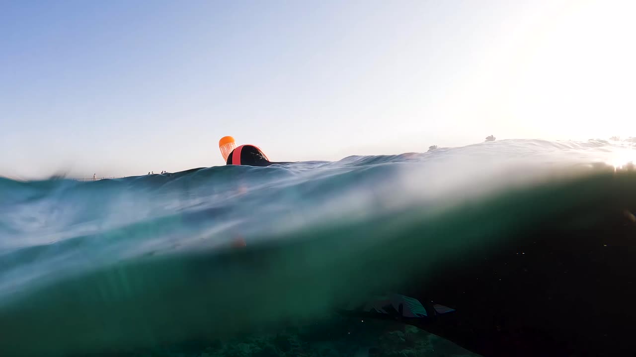 POV shot of a woman snorkelling over coral reefs in the Red Sea in Egypt