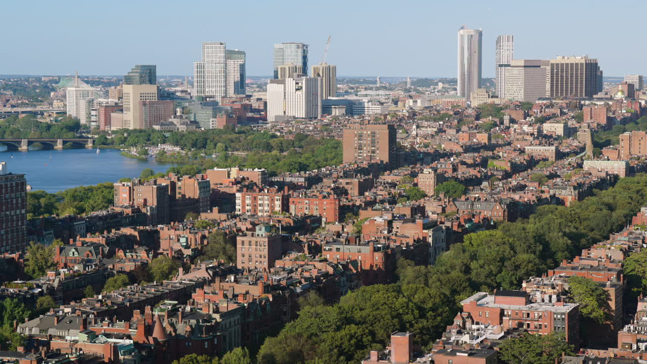 Static high angle shot of Back Bay East in Boston with Charles River and distant skyscrapers