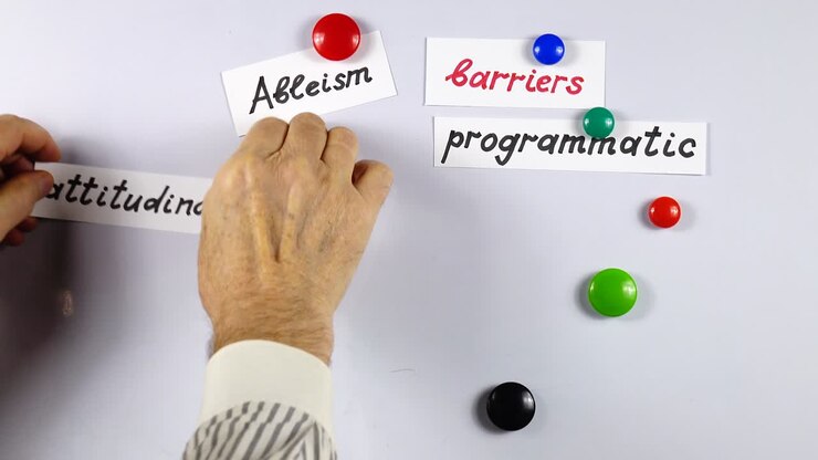 Presentation about ableism on a white magnetic board