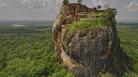 sigiriya sri lanka aerial v7 drone fly around historical and archaeological site capturing ruins of ancient city and fortress built on top of sigiriya lion rock - shot with mavic 3 cine - april 2023