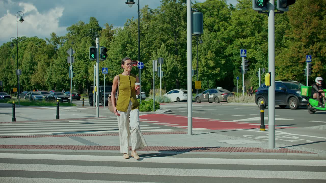 Woman Crossing the Street on a Crosswalk