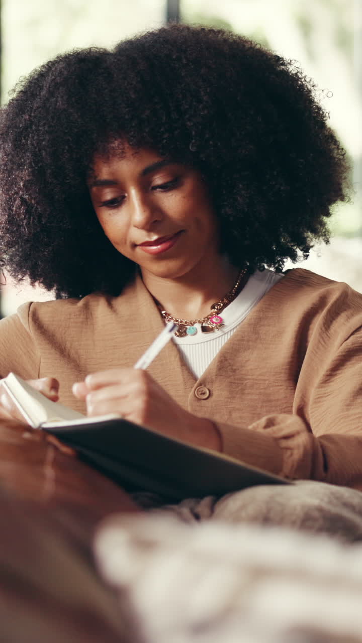 Woman Writing in Notebook