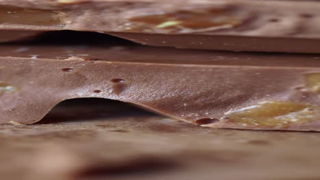 close up of a stack of chocolate caramel bars