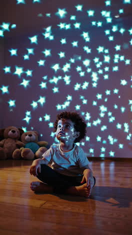 a curious child's interactions with glowing star projections in a room