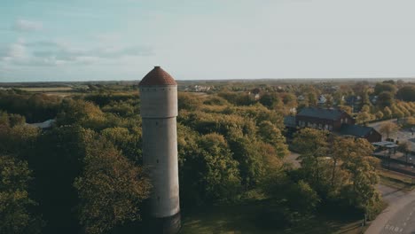 drone flying by a tower in danish town, ribe