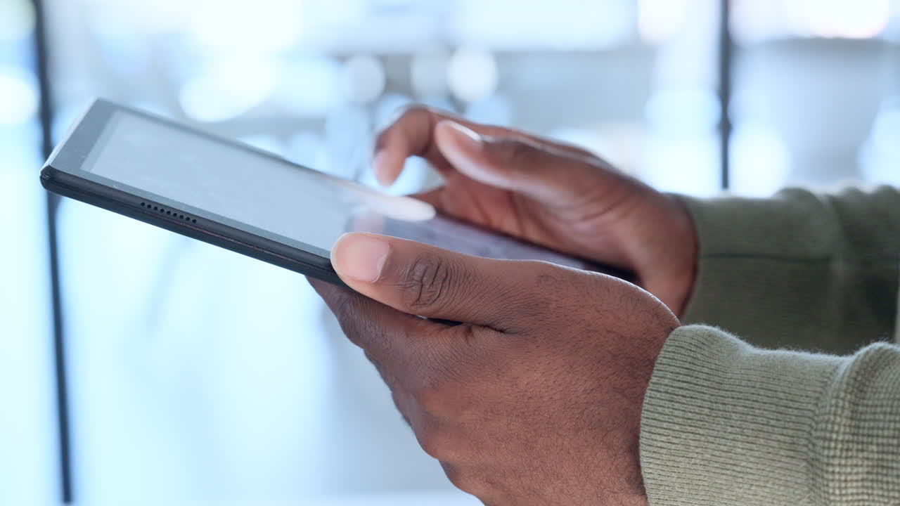 Businessman hands holding digital tablet