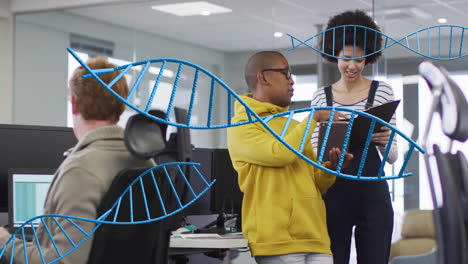 dna strand animation over diverse colleagues collaborating in modern office