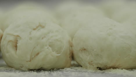 preparing dough balls for baking