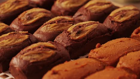 fresh bake double chocolate banana artesian bread in bakery shop close-up. artisan bread is making by skill bakers using natural and high-quality ingredients. food with health and flavour benefits. sweet breads for dessert and breakfast