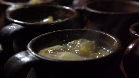 slow motion cooking of cocido madrileño, traditional chickpea-based stew from madrid, spain