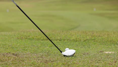 golf ball being struck off the tee.